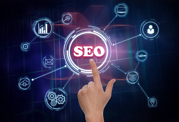 istock SEO directions with icons of keyword research, customization and others. Man using virtual screen 1342476945