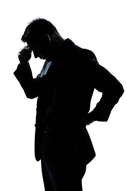 istock silhouette man portrait thinking tired looking down 134247713