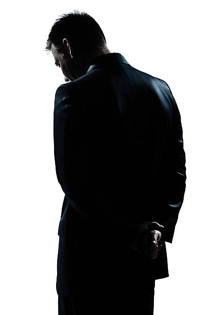 silhouette man portrait backside sad despair lonely one caucasian man portrait silhouette backside sad despair lonely in studio white background silhouette of depressing stock pictures, royalty-free photos & images