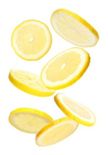 Set of falling delicious lemons on white background