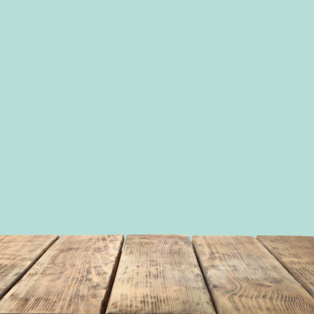 istock Empty wooden surface on mint background. Mockup for design 1342478782