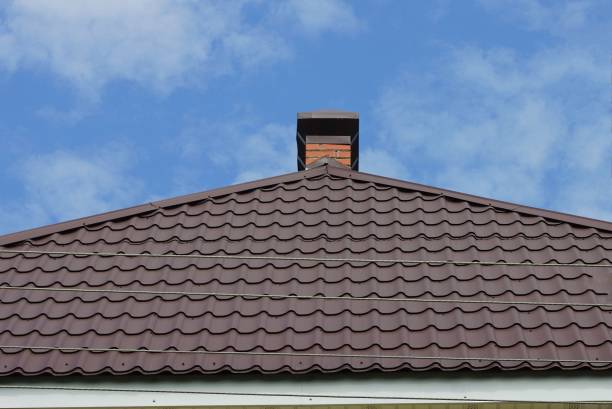 istock one brick metal chimney on the brown tiled roof 1342480263