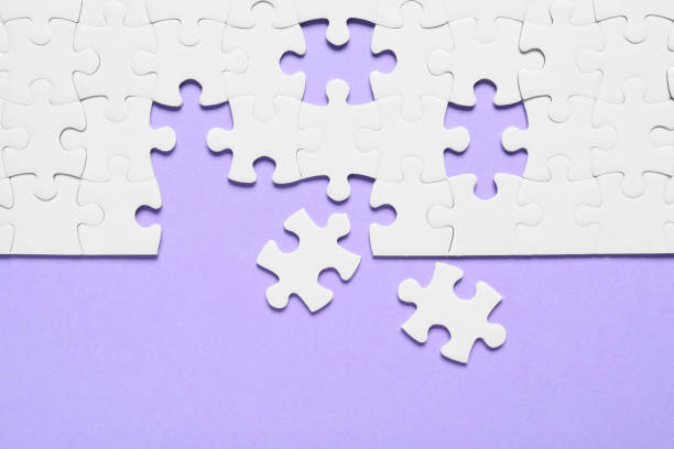 istock Blank white puzzle pieces on violet background, flat lay 1342480480