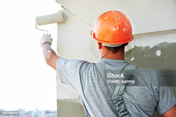 Construction Working Putting Plaster On A Wall Stock Photo - Download Image Now - Painting - Activity, House, Paint