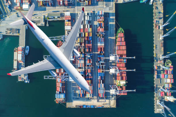 Container ships and transport aircraft in the export stock photo