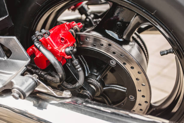 istock Red brake caliper on a motorcycle wheel 1342484886