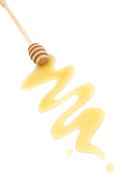 istock Honey dripping from a wooden dipper 134248597
