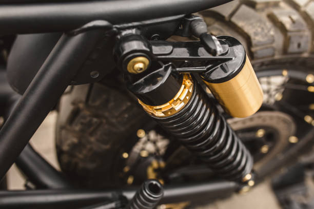 オートバイのサスペンショントップビュー - 光沢のあるスプリングとショックアブソーバー - shock absorber ストックフォトと画像