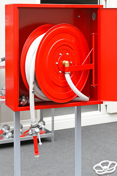 istock Red and white fire hose in a red box  134249134