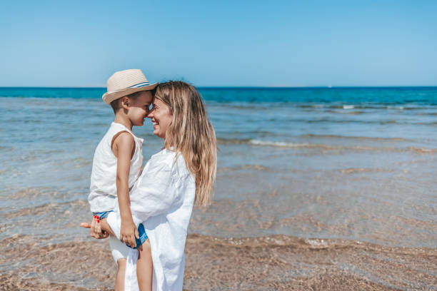 istock Mother and son playing on the beach 1342492123