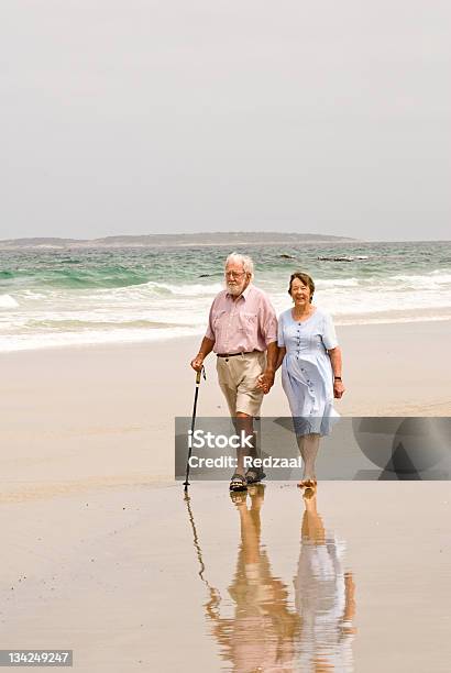 Senior Couple Walking On Beach East Coast Tasmania Australia Stock Photo - Download Image Now