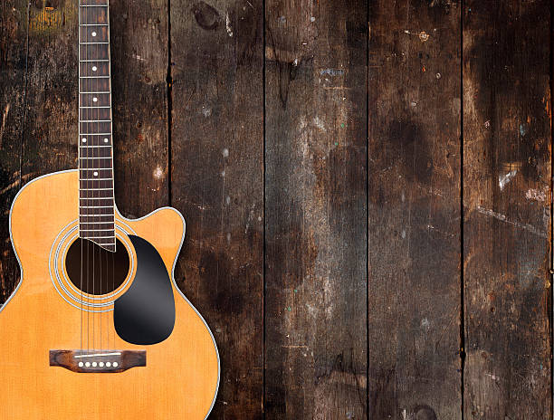 Guitar on rustic wood background