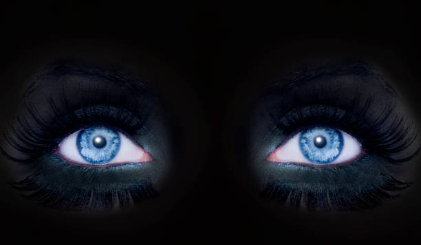 istock blue eyes darked face makeup black panther woman 1342494337