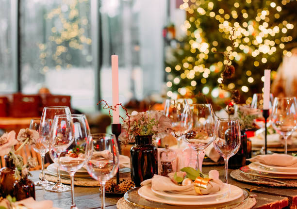 festive large table decorated with christmas symbols candles festive large table decorated with christmas symbols candles sparkle party celebration luxury hall"r"n restaurant table card stock pictures, royalty-free photos & images