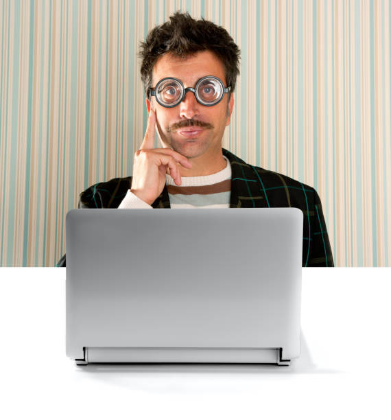 istock Nerd pensive man glasses silly expression laptop 1342497454