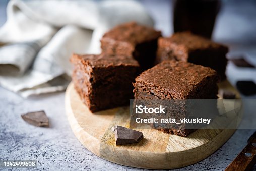 istock Chocolate brownie with chocolate drops 1342499608
