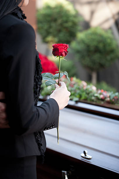 Woman at Funeral with coffin Religion, death and dolor  - funeral and cemetery; funeral with coffin coffin photos stock pictures, royalty-free photos & images