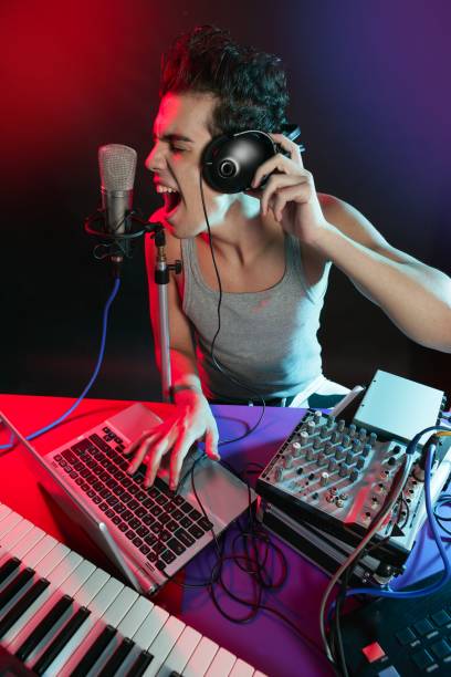 istock Dj with colorful light and music mixing equipment 1342500254