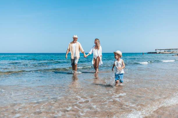 istock Young family enjoying a day at the beach 1342500551
