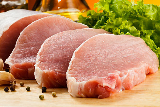 Fresh raw pork on a cutting board stock photo