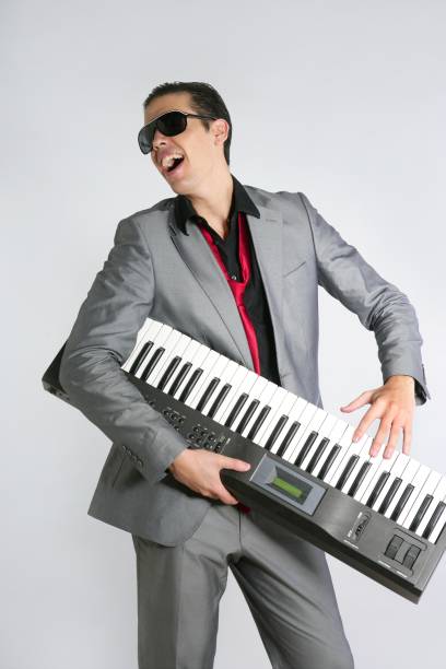 istock Businessman musician playing instrument with suit 1342501600
