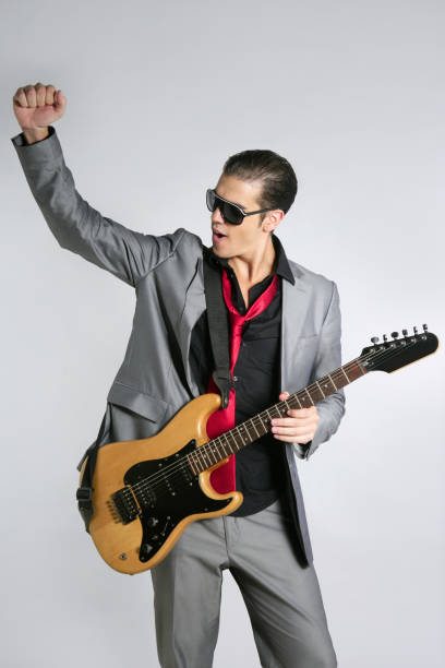 istock Businessman musician playing instrument with suit 1342501623