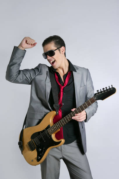 istock Businessman musician playing instrument with suit 1342501644