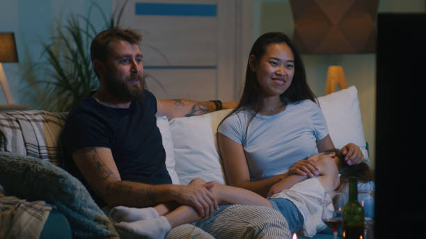 istock Diverse family discussing film on sofa 1342501768