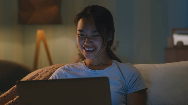 istock Happy female making video call in evening 1342503350