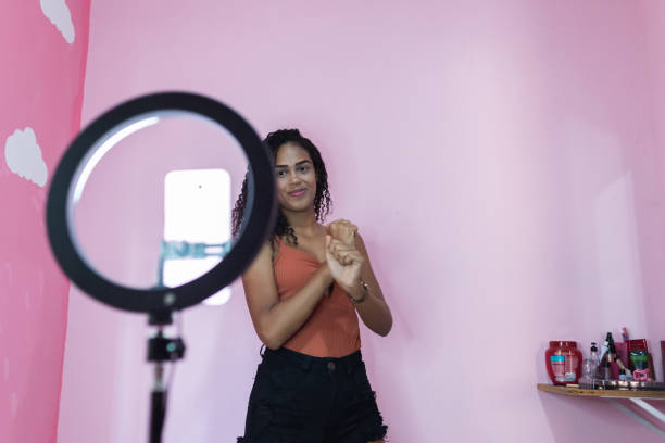 Black young woman filming herself dancing at home to share on social media Black young woman filming herself dancing at home to share on social media moving image stock pictures, royalty-free photos & images