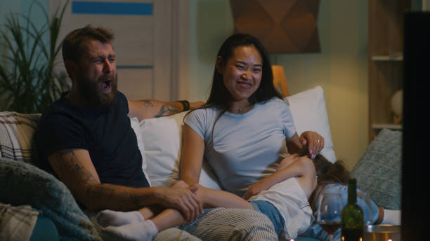 istock Diverse family discussing film on sofa 1342504563