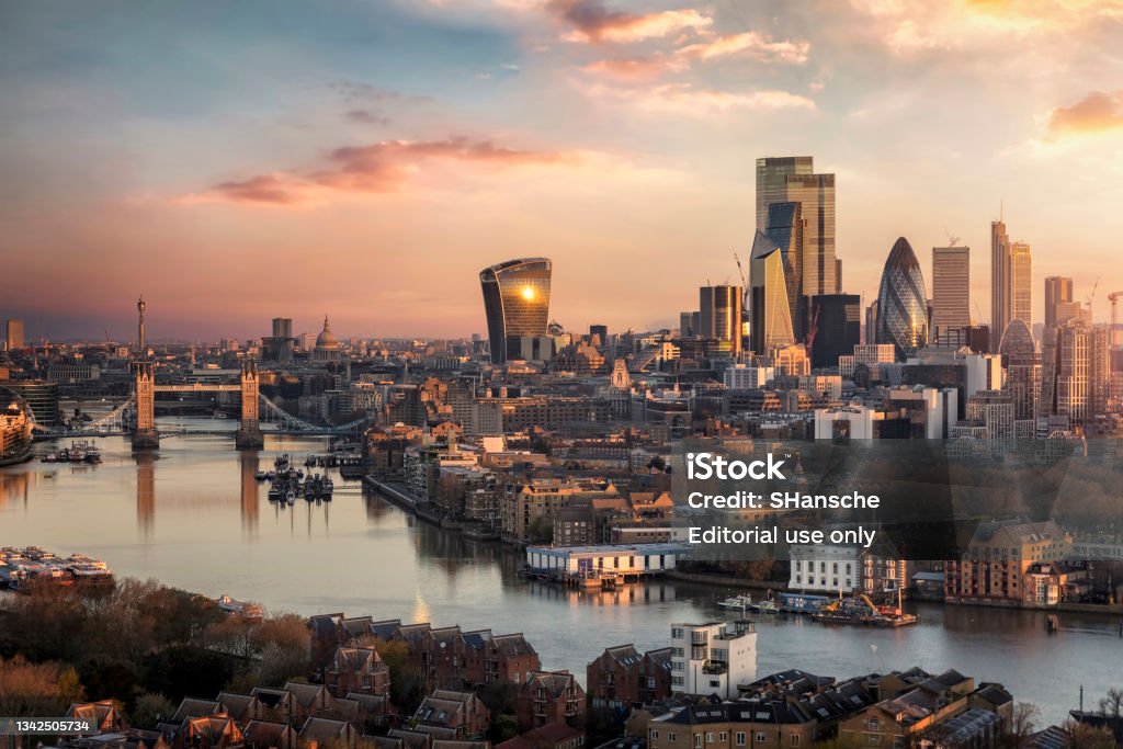 The skyline of London city with Tower Bridge and financial district during sunrise The skyline of London city with Tower Bridge and financial district skyscrapers during sunrise, England, United Kingdom London - England Stock Photo