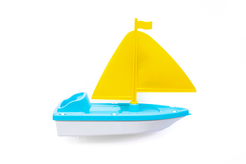 Toy sailboat isolated on the white background.