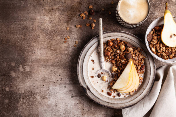 istock Chocolate granola with almond milk, pear and honey. 1342512155