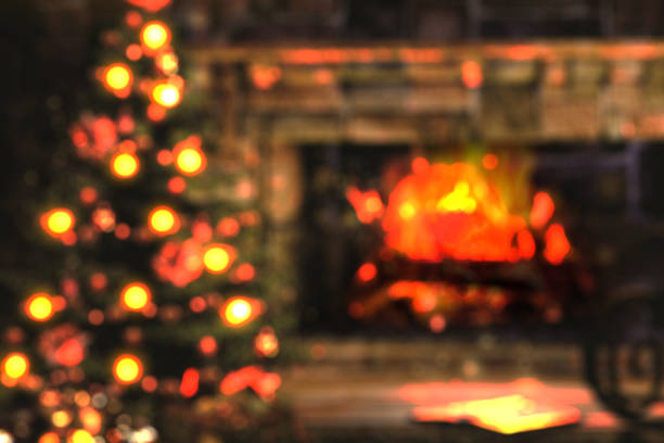 istock blurred image of christmas tree and fireplace background for art or picture background 1342513005
