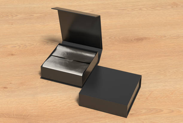 istock Black opened and closed square folding gift box mock up with silver wrapping paper on wooden background. Side view. 1342513177