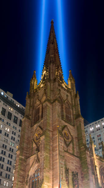 9/11 Tribute in Light. Trinity Church illuminated at night. View from Broadway. 9/11 Tribute in Light. Trinity Church illuminated at night. View from Broadway. to the struggle against world terrorism statue photos stock pictures, royalty-free photos & images