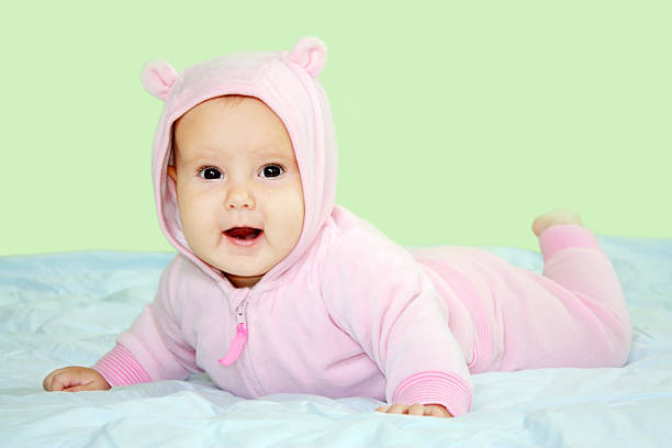 istock Baby in pink teddy costume 134252647