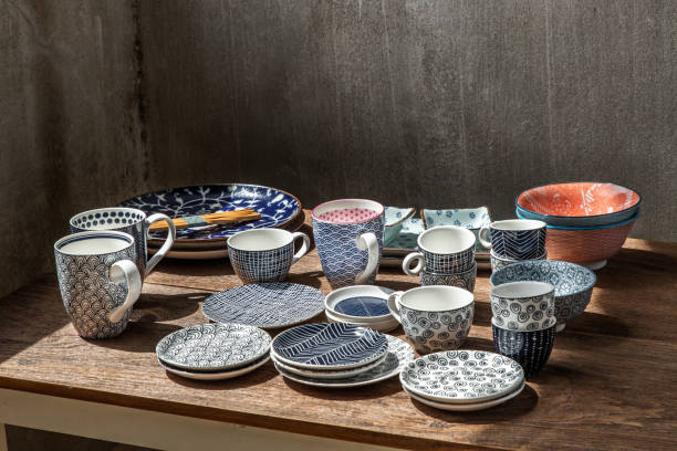 istock Different Ceramic Plates, Bowl and cup on wooden table. 1342530593