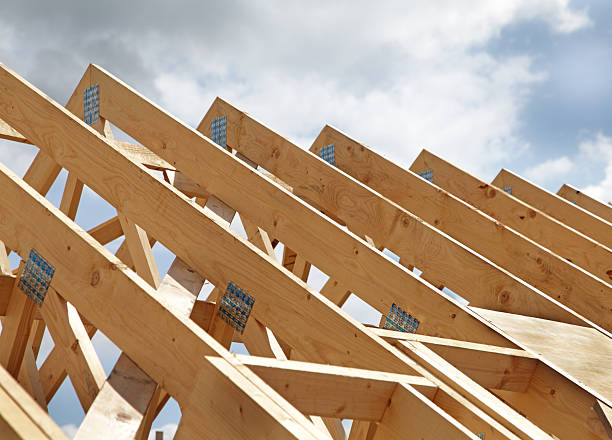 Construction of a wooden roof frame underway stock photo