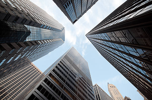 istock Low angle shot of blue sky through skyscrapers 134254215