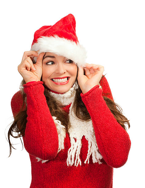 istock Attractive woman peeking out from santa hat 134254279