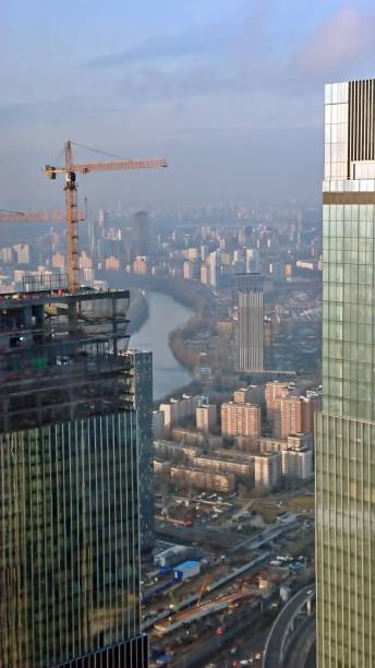 istock Skyscraper under construction on the background of the Moskva River 1342552576