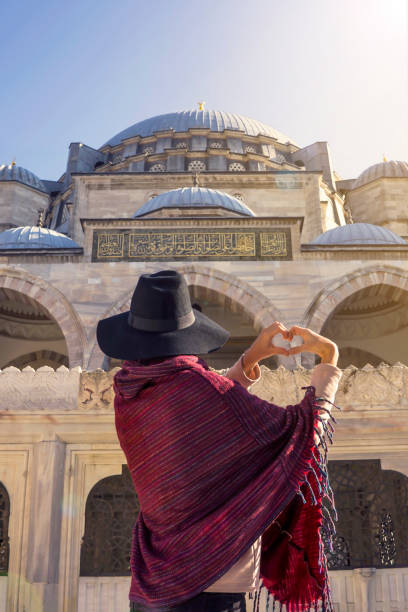 istock A young traveler in a hat and red poncho. 1342569195