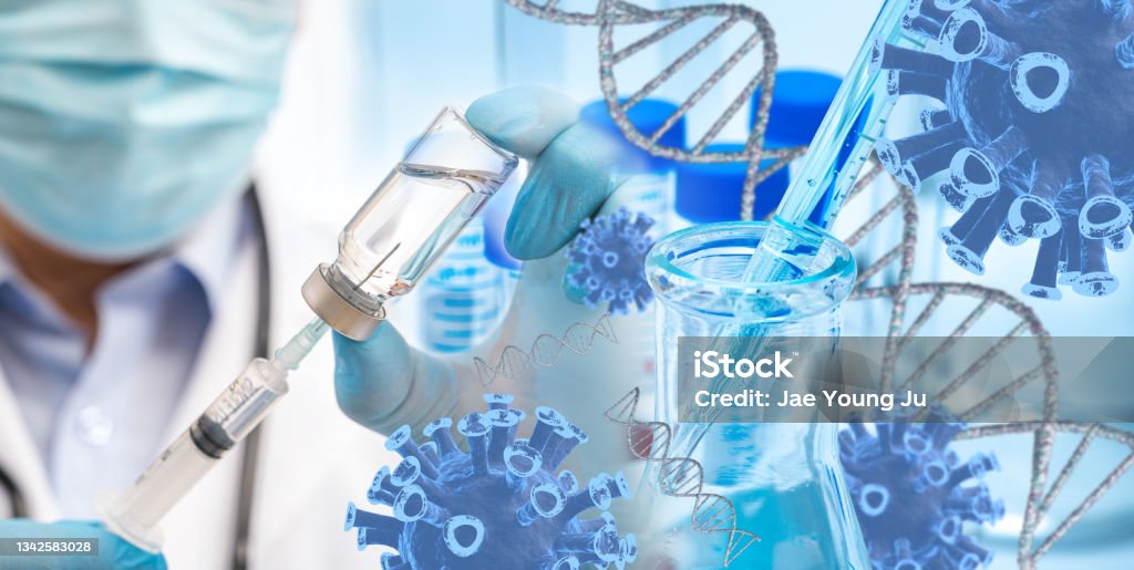 The doctor's hand wearing blue gloves against white background and holding Covid-19 vaccine The doctor's hand wearing blue gloves against white background and holding Covid-19 vaccine. Lifestyles Stock Photo
