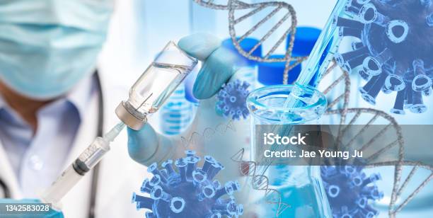 The Doctors Hand Wearing Blue Gloves Against White Background And Holding Covid19 Vaccine Stock Photo - Download Image Now