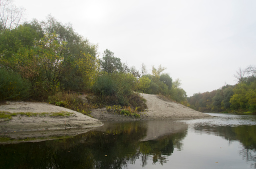 Landscape of an autumn river with sandy banks