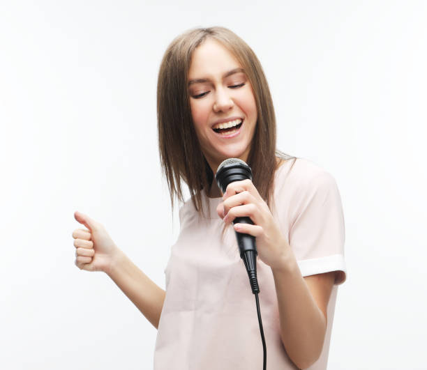 istock beautiful stylish woman singing karaoke 1342604355