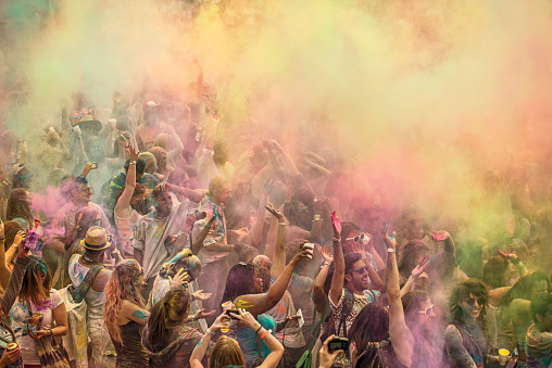 New York, USA - May 3, 2014: Celebrating Holi Color Festival in Brooklyn New York, USA. People with painted faces. Holi is a festival celebrated as a festival of colors