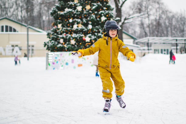istock Little boy skating in ice ring 1342607827
